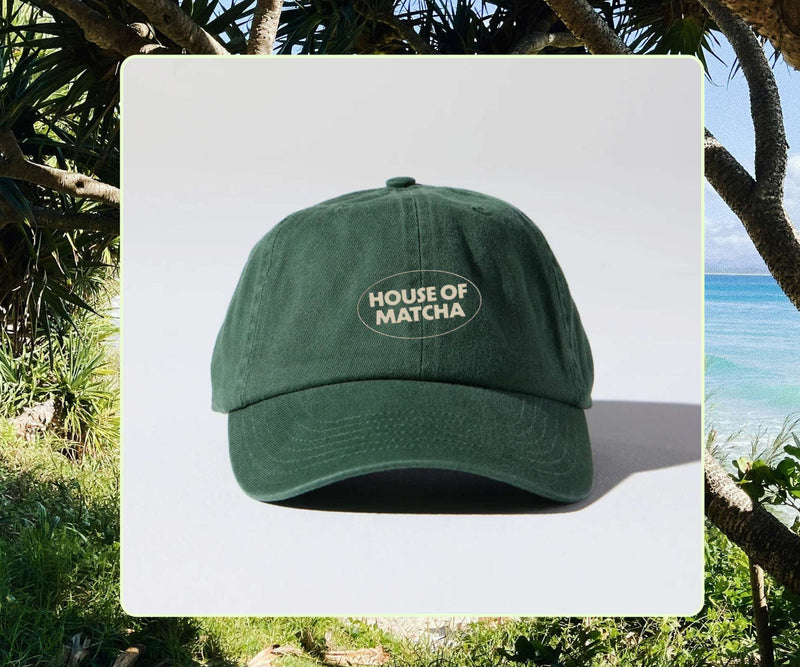 Green cap with 'House of Matcha' logo on a white background